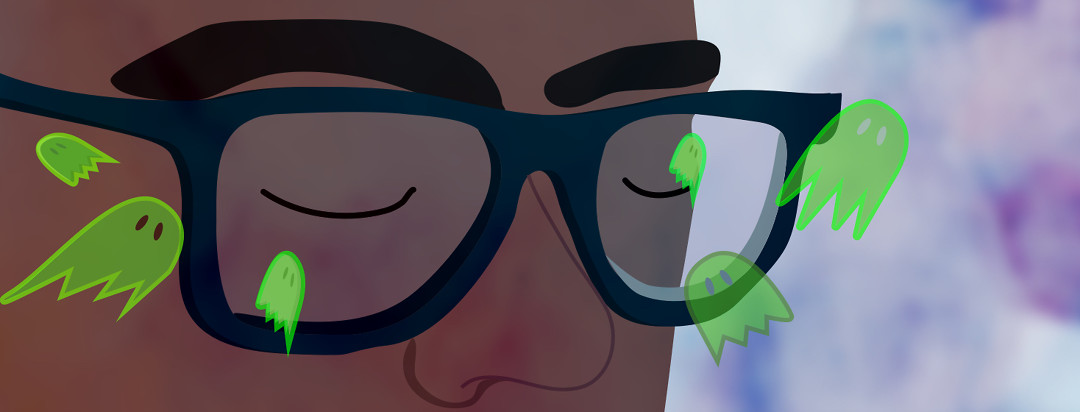 A person with their eyes closed while green ghosts are flying around their glasses.