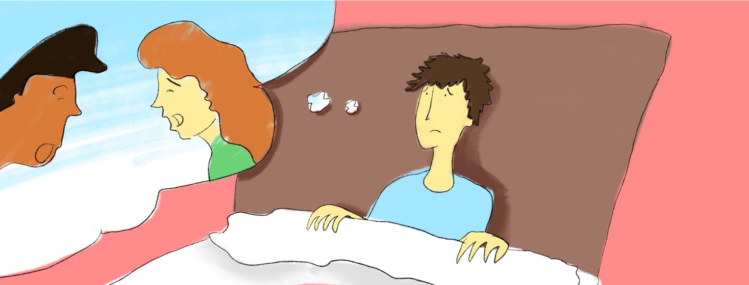 A person lies in bed frowning, thinking of friends.