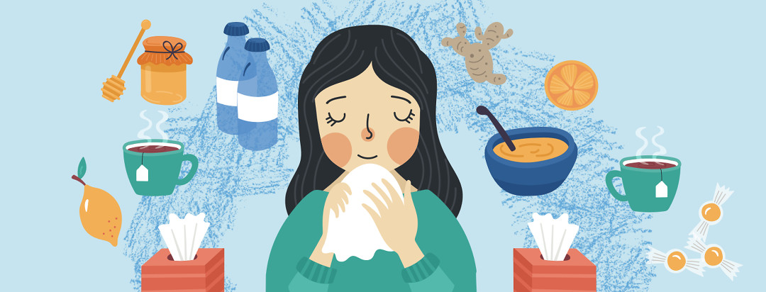 A smiling woman with a cold surrounded by tissues, soup and tea.