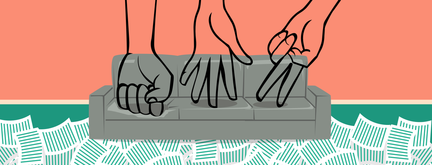 Three hands sitting on a couch. One making a fist like a rock, one laying flat like paper, and the last one is making a scissor shape. Rock, Paper, Scissors.
