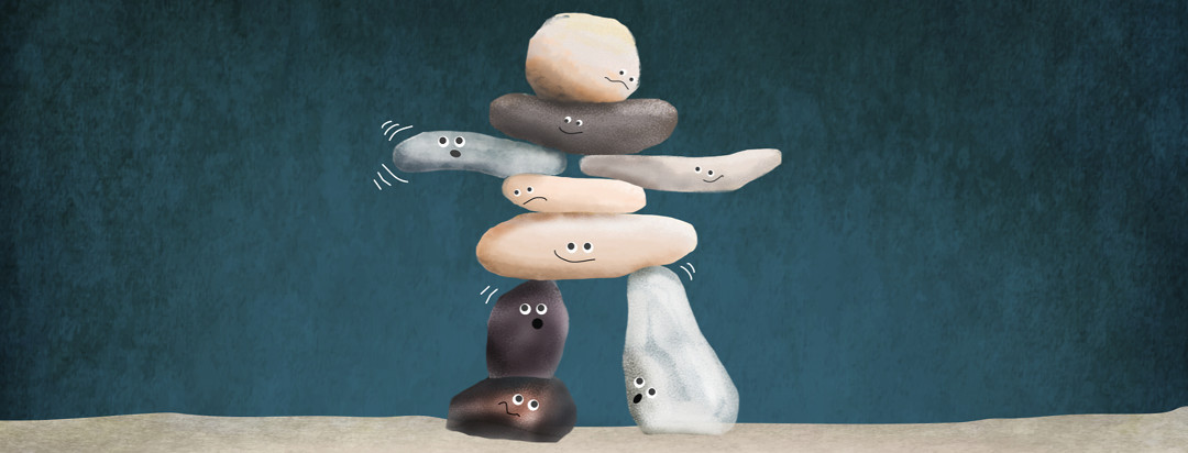 A precarious pile of rocks balancing to form a human shape. Each rock has a face and is worried about the wiggly one.