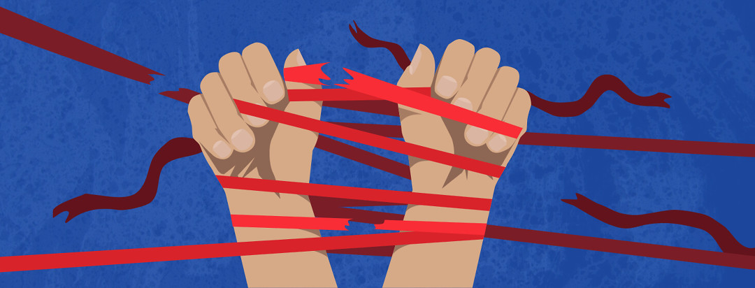 Two hands are tied together with red tape as the person struggles to break free. Some of the ribbons start to break.