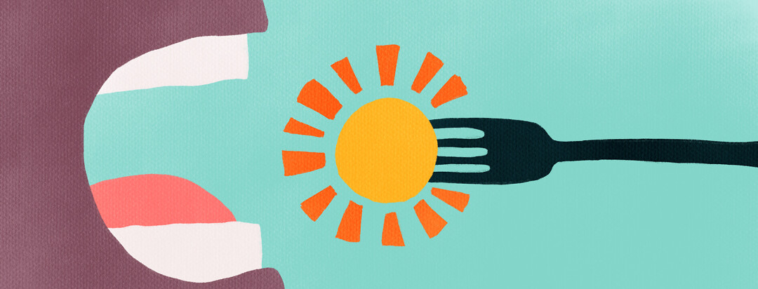 A close up of a fork with sunshine on it going in someone's mouth.