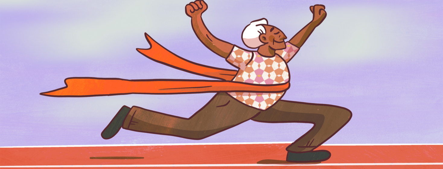 Adult male runs across a finish line