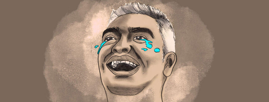 a man has tears streaming down his face as he is laughing